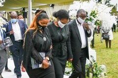 From left Anerlise, Tabitha and James Karanja pictured at the funeral of Tecra Karanja, May 16, 2020.
