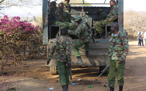 General Service Unit (GSU) officers boarding a patrol vehicle.