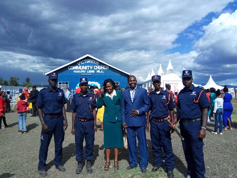 Duncan Kobetbet posing for a photo with the security team from his firm on November 6, 2016.
