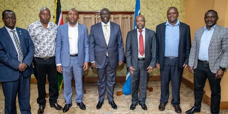 Deputy President Rigathi Gachagua and his high school classmates pose for a photo during their reunion at Harambee House Annex on March, 6, 2023