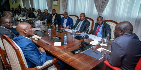 Deputy President Rigathi Gachagua and his high school classmates pose for a photo during their reunion at Harambee House Annex on March, 6, 2023