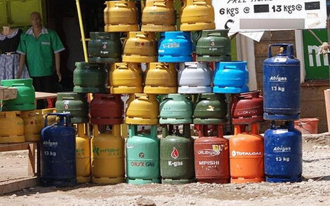 Gas cylinders on display by a roadside.