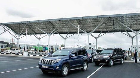 Government vehicles pictured at the JKIA exit area.