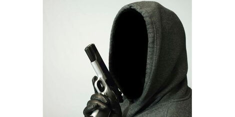 A gunman in a balaclava