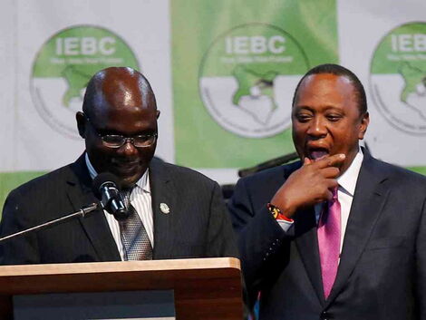IEBC chairman Wafula Chebukati and President Uhuru Kenyatta at the IEBC National Tallying Centre at the Bomas of Kenya, Nairobi, August 11, 2017, when Uhuru was announced winner of the presidential election.jpg