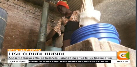 A photo of Milly Nafula taken at her workstation on December 7, 2021.