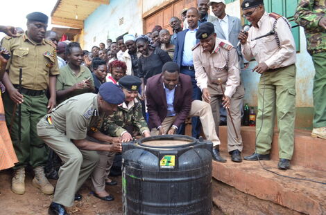 Tharaka-Nithi Governor Muthomi Njuki leading a multi-agency team in raiding illicit brew during a past operation.