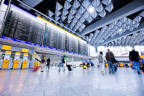 Individuals at an airport lobby