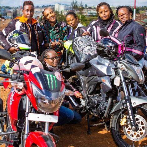 The Ink Sisterhood posing for a photo after a ride 