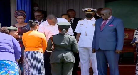 President Uhuru Kenyatta speaks with an inmate from Lang'ata Women Prisons at State House on Friday, May 13, 2022.