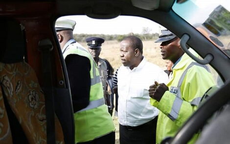 Interior CS Fred Matiang'i interacts with Police officers during a past traffic crackdown