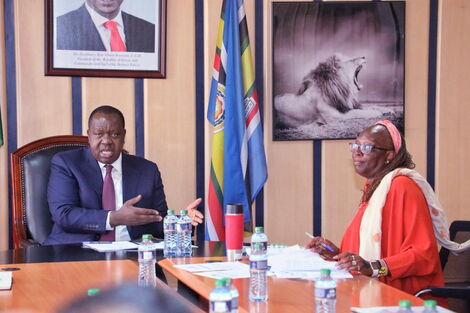 Interior CS Fred Matiangi (left) and his Industrialisation counterpart Betty Maina during a meeting