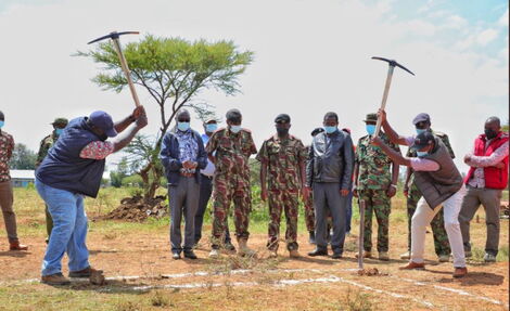 Interior CS Fred Matiang'i (left) takes part in construction of a house in Laikipia on Saturday, September 11, 2021.