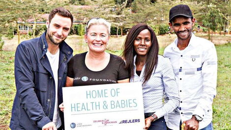 Isaac Macharia (right), his wife Veronica Nyaruai (second right) and sponsors of an upcoming clinic in Ngong.