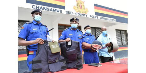 Police showing military gear they recovered from a civilian in July 2021.
