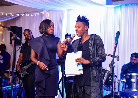 Jacque Maribe (left) with comedian Fred Omondi (right) at a Nairobi entertainment joint in December 2019