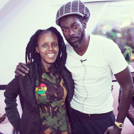Jahmby Koikai (Left) and Jamaican Singer Buju Banton strike a pose.
