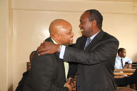 Jeff Koinange,(right) hugs political analyst Tony Gachoka when the two met at Milimani on June 5, 2015.