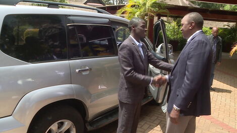 President Uhuru Kenyatta )right) hands Igembe South MP John Paul Mwirigi car keys after a Sagana Lodge meeting in 2017.