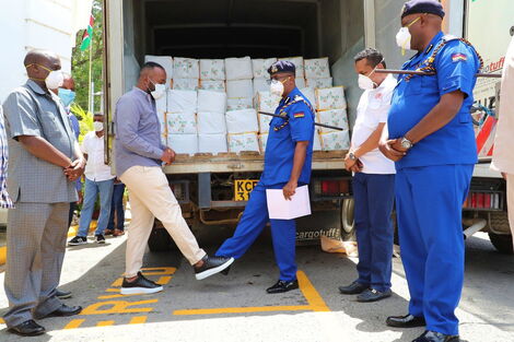 Mombasa Governor Ali Hassan Joho pictured with Police Inspector-General Hillary Mutyambai after the police donated 400 bales of flour in Mombasa on March 15, 2020