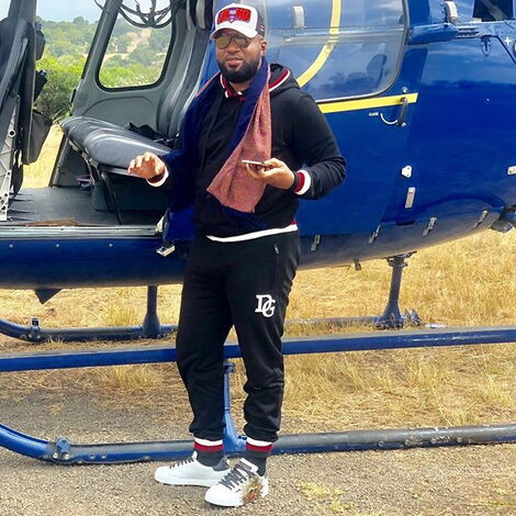Mombasa Governor Ali Hassan Joho poses for a photo alongside a helicopter in 2019