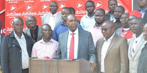 Jubilee Secretary-General Jeremiah Kioni and a section of Jubilee Party members at the party headquarters in Nairobi on Monday, March 21, 2022.j