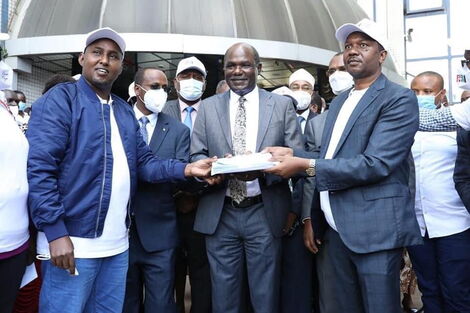 Suna East MP Junet Mohamed, IEBC Chair Wafula Chebukati and BBI Secretariat Co-Chair Dennis Waweru submit signatures at IEBC headquarters on December 10, 2020