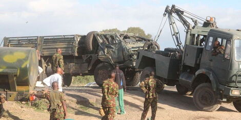 KDF soldiers tow away one of their trucks that was involved in an accident 