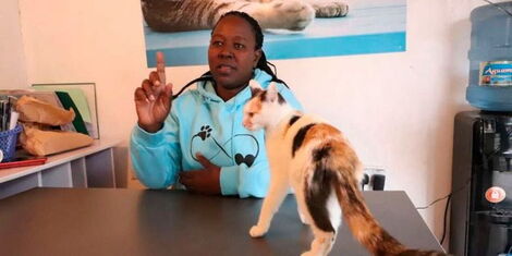 Rachel Kabue with some of her cats at her Sanctuary