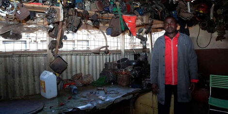 Stanley Kagora Ongiri at his mechanic shop in Kisii town.
