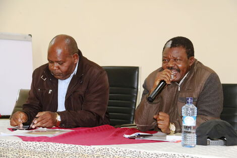 Rabai MP Kamoti Mwamkale (right) addresses members of public during a public participation forum in Meru county on September 2, 2019