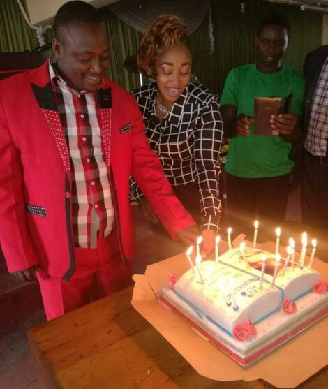 Pastor Victor Kanyari pictured cutting a cake during a ceremony at his church