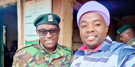 Philanthropist Karangu Muraya and a prison warden at G.K prison Thika on Tuesday, November 22, 2022
