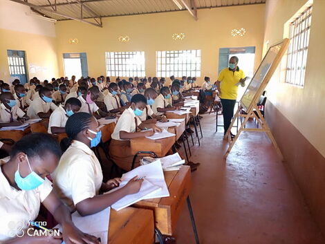 St Peter's Secondary Gathuthiini students listening to Interior PS Karanja Kibicho teaching Mathematics on March 1, 2021