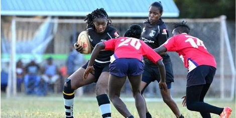 File photo of police constable Sylvia Kavere holding the ball during a past rugby match