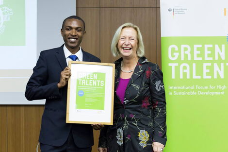 Kennedy Liti Mbeva receiving the Green Talents Fellowship Award, from the Federal Minister for Education and Research, in Berlin, Germany October 2014.