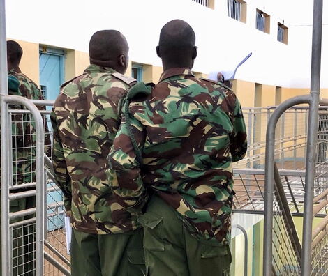 Kenya Police Officers inspecting a prison facility.