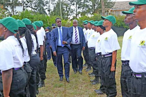 Fazul Mahamed, head of Kenya's Private Security Regulatory Authority, inspects an honor guard mounted by trainee guards in Karen, Nairobi, in January 2019.