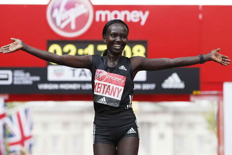 Kenya's Mary Keitany celebrates after winning the women's elite race at the London marathon on April 23, 2017 in London.
