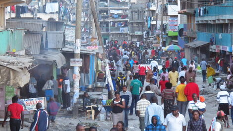 Kenyans at a street in Nairobi City's downtown area.