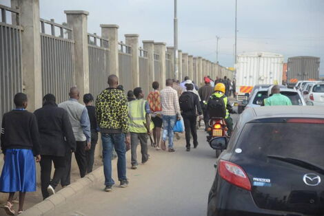 https://www.kenyans.co.ke/files/styles/article_inner_mobile/public/images/media/Kenyans%20walk.jpg?itok=dNmig4tJ https://www.kenyans.co.ke/files/styles/article_inner_mobile/public/images/media/Kenyans%20walk.jpg?itok=dNmig4tJ