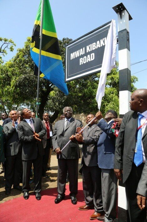 Former President Mwai Kibaki unveiling the Mwai Kibaki Road in Dar-Salaam