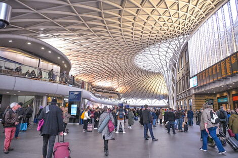 An image of travellers moving to the King's Cross railway terminus in London on Thursday, February 23, 2022.