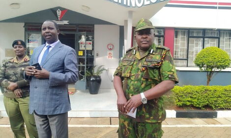 A file photo of Kiambu County Commissioner Joshua Nkanatha(middle) and Kiambu Police Commander Perminus Kioi(right) 