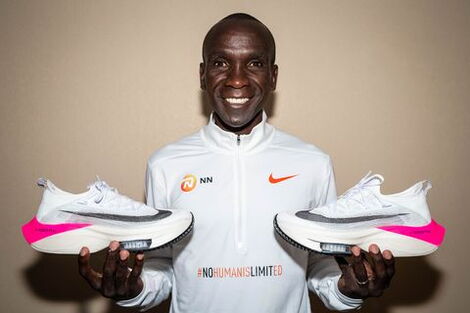 Marathon Record Holder Eliud Kipchoge Holding His Racing Shoes