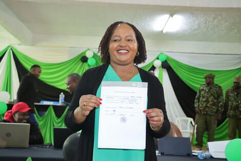 Kirinyaga governor-elect Anne Waiguru holding his election certificate after emerging victorious on August 12, 2022