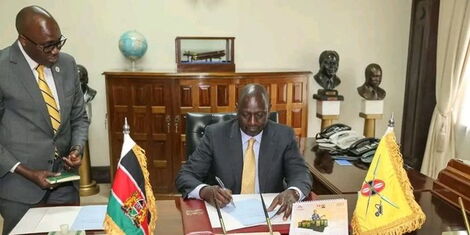 Korir Sing'oei watches as President William Ruto signs the nomination of six judges to the State House Court of Appeals on Tuesday, September 13, 2022.