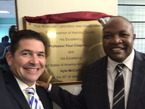 US Ambassador Kyle McCarter poses with Kericho Governor Paul Chepkwony after unveiling medical equipment in Kericho on January 30, 2020