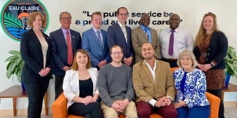 Larry Mboga (standing, third from right) and other memebers of the Eau Claire City Council Members.jpg