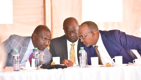 Left to right Deputy President William Ruto talks to his running mate Rigathi Gachagua and Garissa Town MP Aden Duale.